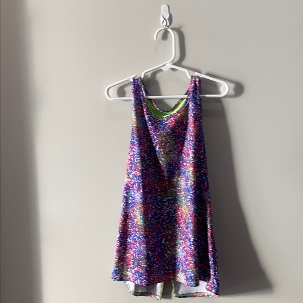 It is colorful and it is a Athletic shirt for kids